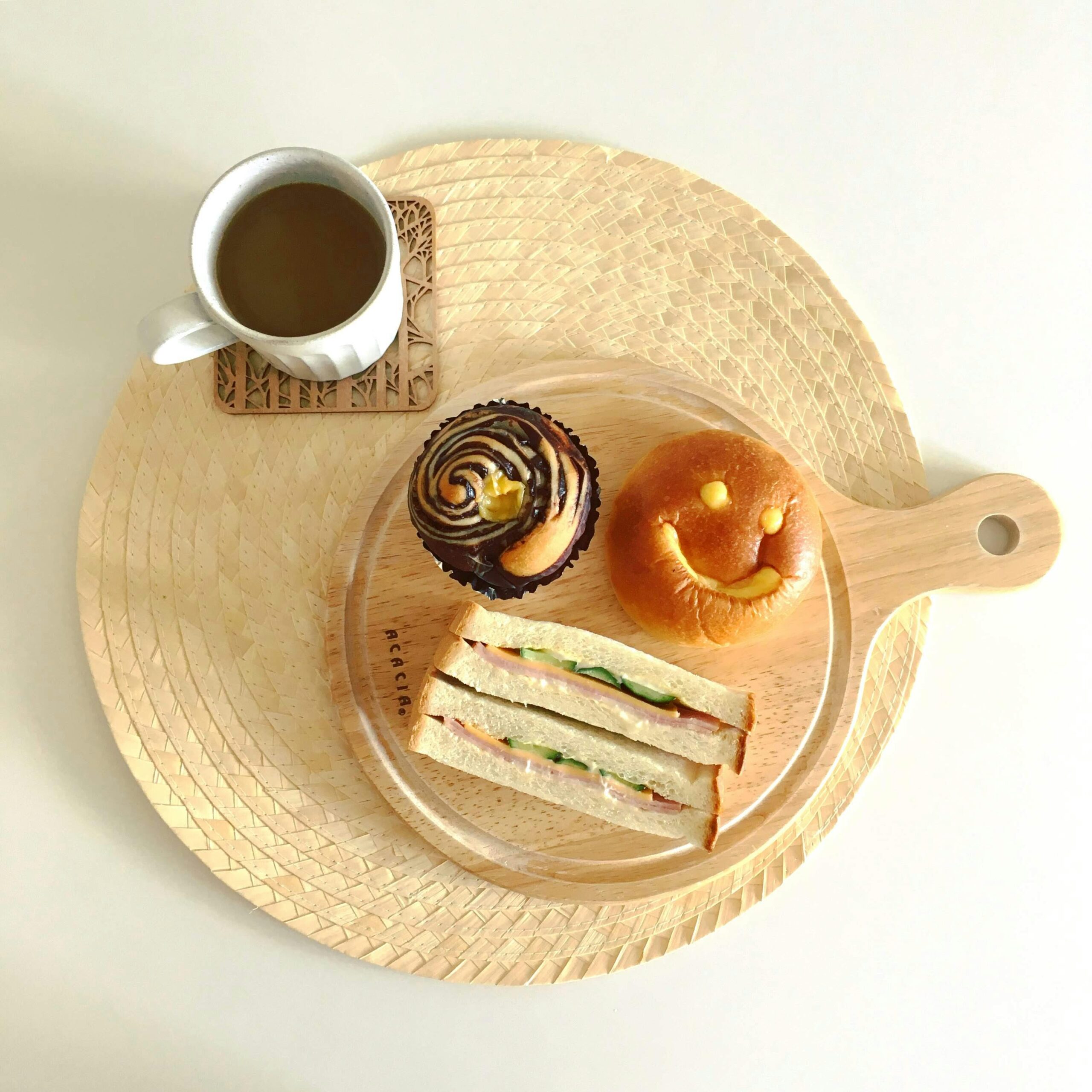 Enjoy a delightful breakfast with a sandwich, cupcake, and coffee in Kyoto, Japan.