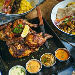 Savor the taste of perfectly grilled chicken paired with a selection of flavorful dipping sauces.